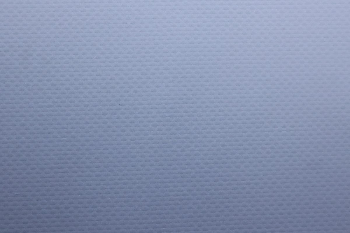 A cross-section diagram illustrating the distinct plain weave scrim layer in a semi-coated banner. Diagram showing the layers of a semi-coated banner with plain weave scrim